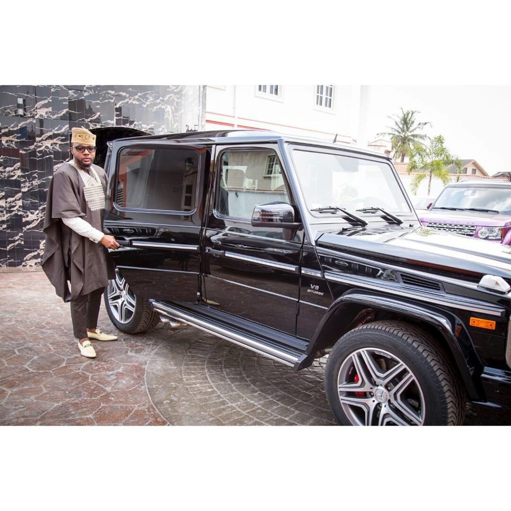 e money entering his Black Mercedes Jeep