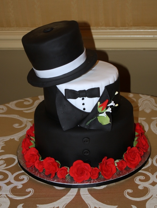black and white cake with red details for a 40 year old man. Suit and top hat