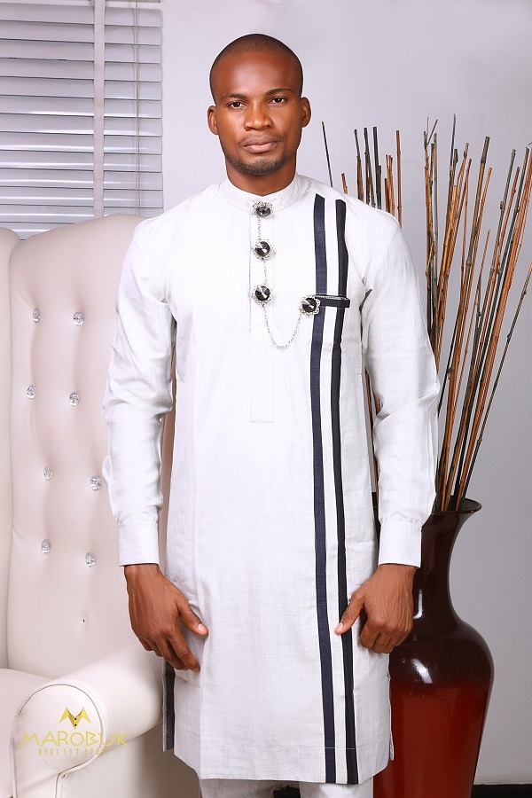 A Model Wearing Nigerian Men Traditional Wears Clothes designed by Chidiebere Ekwunife