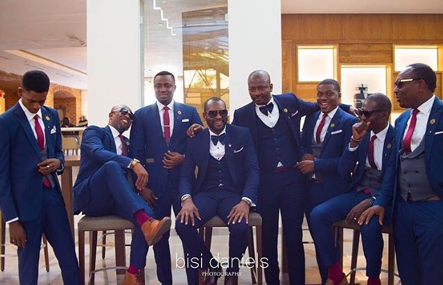grooms men in navy blue suits