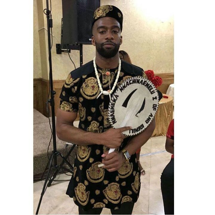 igbo men with traditional fan 